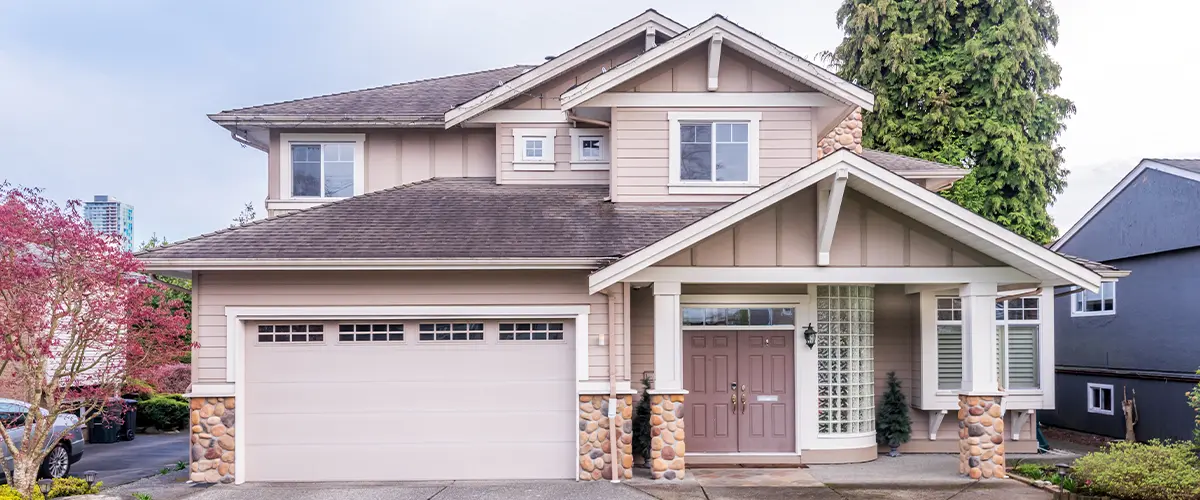 Modern two-story suburban home in Lakewood, with a well-maintained lawn, garage, and front porch.