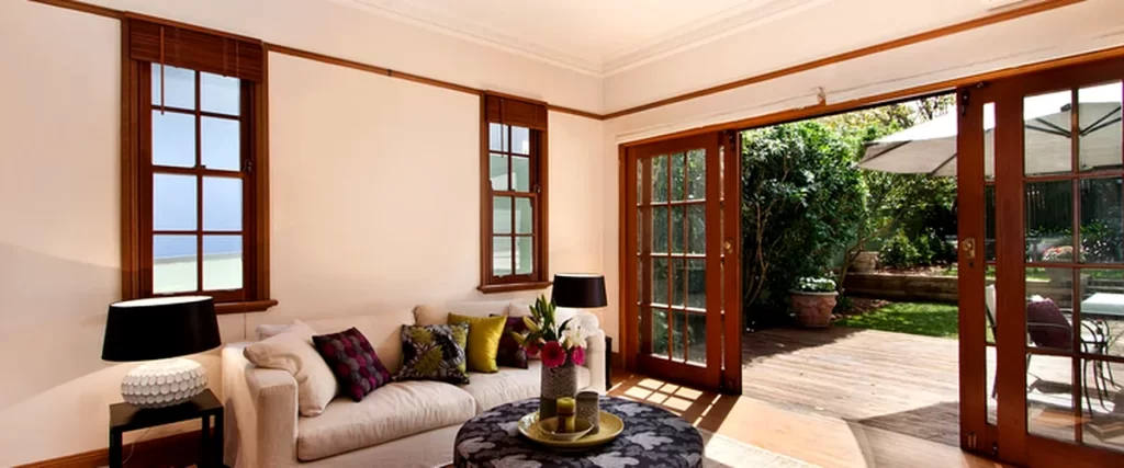 home additions accessory dwelling unit adu floor plan luxurious living room with french doors hardwood floors and garden view
